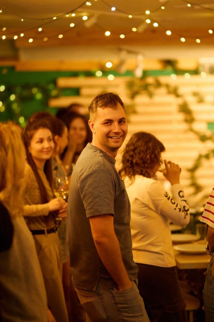 man at a party smiling