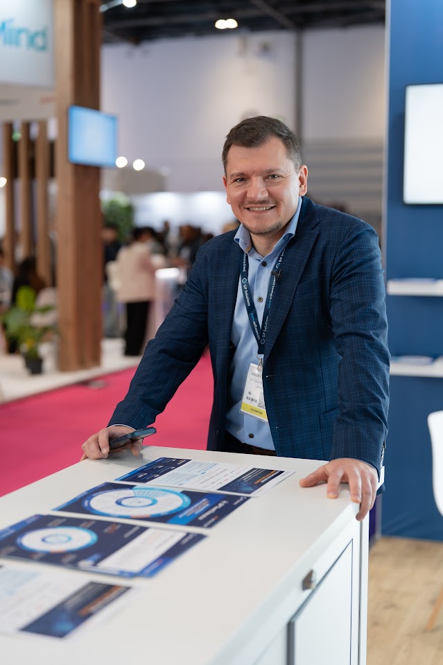 Sergey Zubekhin leaning against a reception desk at WTM London 2025