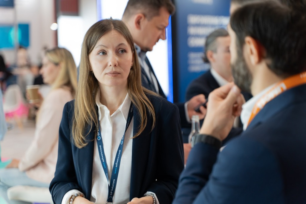 Business development Manager of GP Solutions talking to a visitor at WTM 2025 exhibitor stand