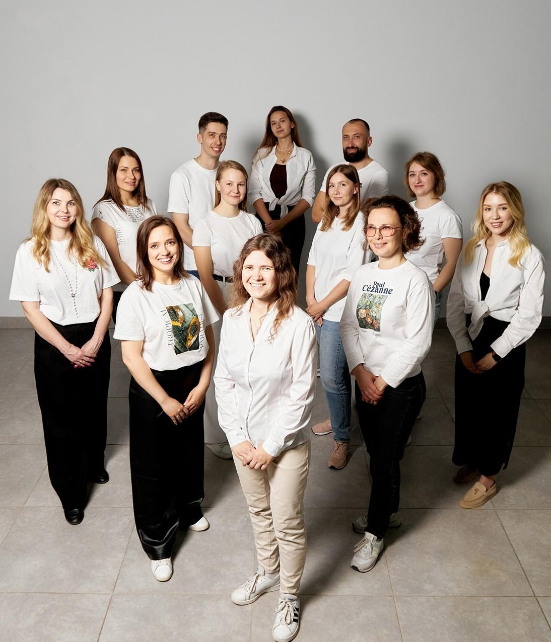 Group photo of Gp Solutions' employees dressed in balck and white